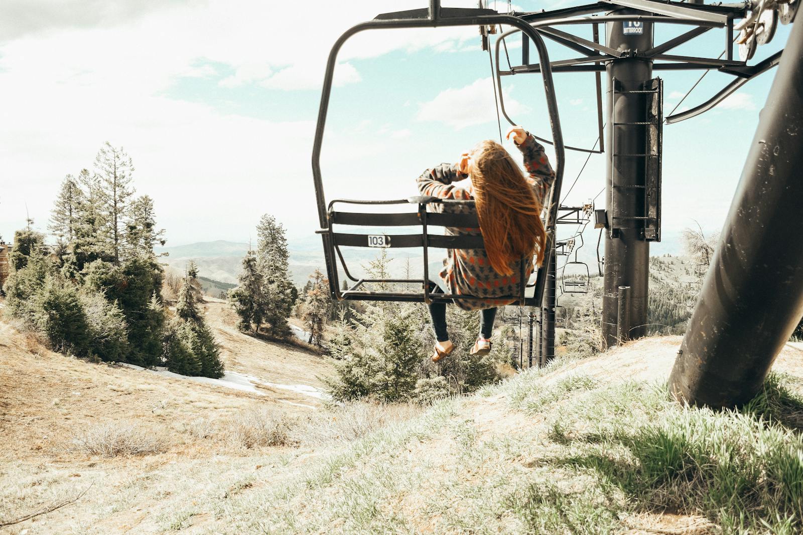 Back View of Woman Sitting on a Ski Lift