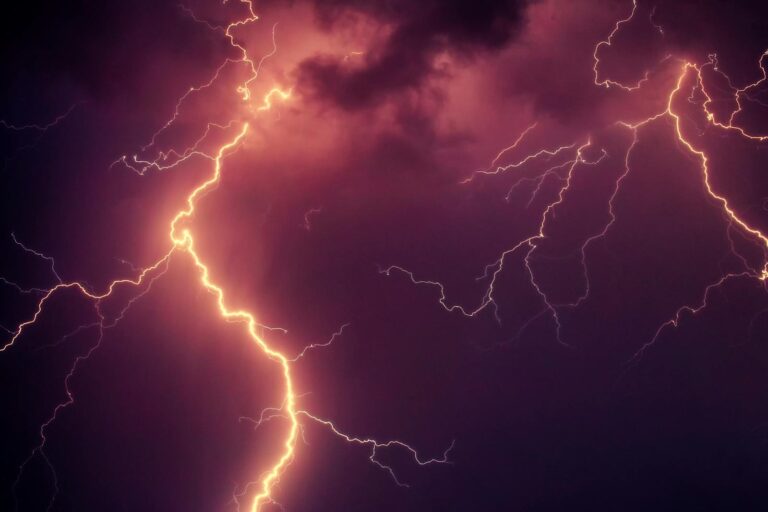 Stunning capture of bright lightning illuminating a dark stormy sky at night.